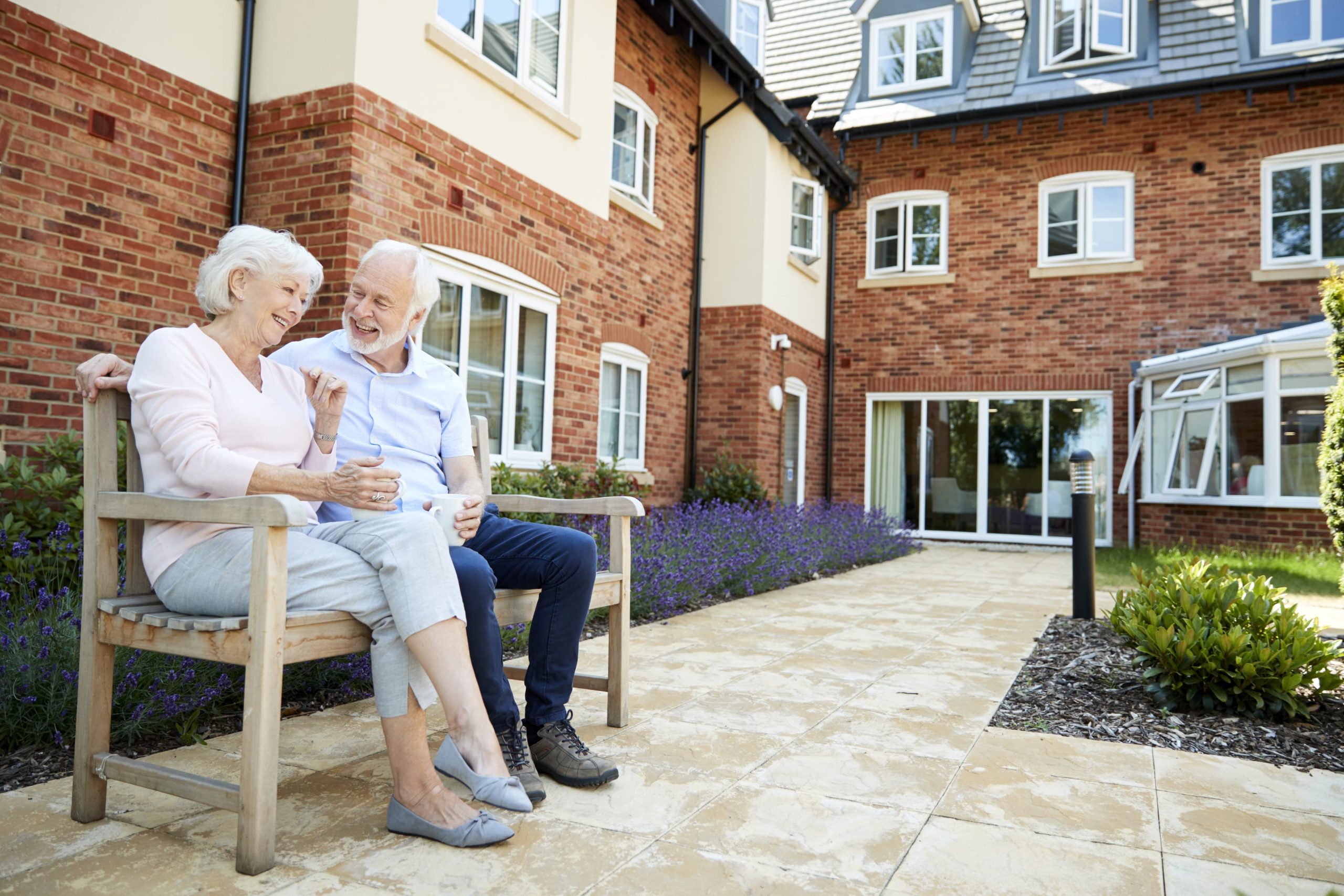 Two seniors sitting on bench